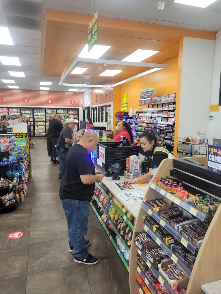 Drivers checking out inside the Roadside Oasis convenience store in Menifee, CA